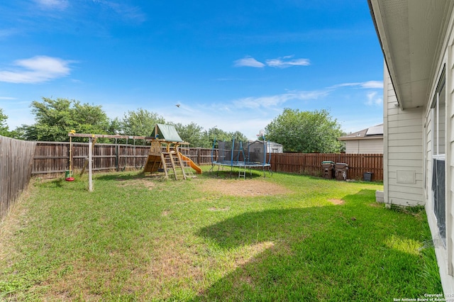 7619 Bit Cir, Elmendorf, TX 78112 - view of yard featuring a playground and a trampoline