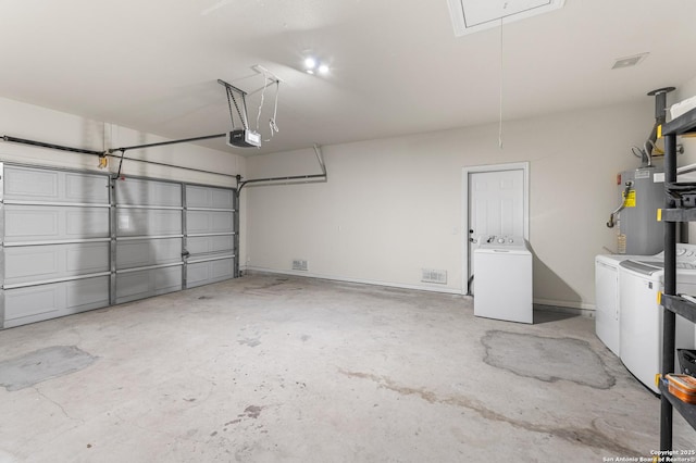 7619 Bit Cir, Elmendorf, TX 78112 - garage with washer and dryer, water heater, and a garage door opener