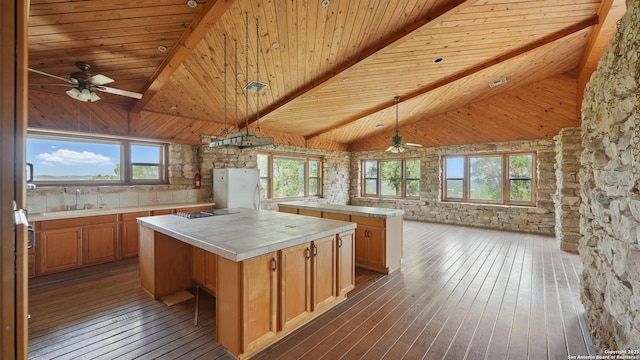 1001 Naked Indian, New Braunfels, TX 78132 - kitchen with a sink, wooden ceiling with exposed beams, a kitchen island, freestanding refrigerator, and ceiling fan