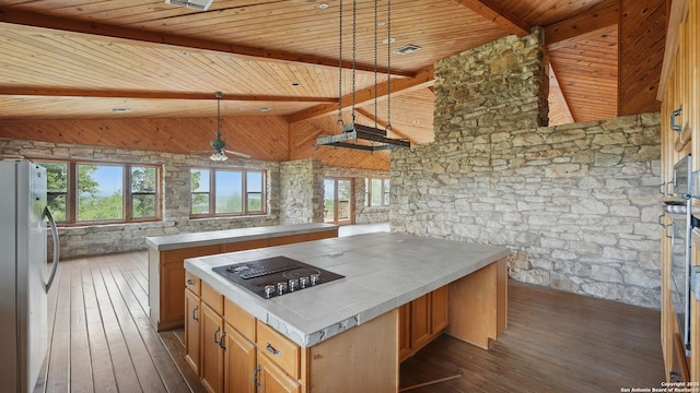 1001 Naked Indian, New Braunfels, TX 78132 - kitchen with freestanding refrigerator, black electric cooktop, tile counters, dark wood finished floors, and wood ceiling with exposed beams