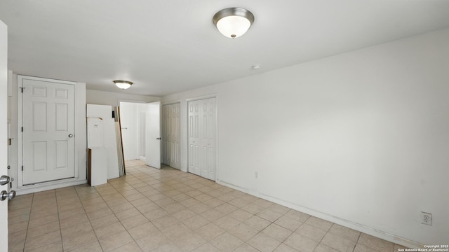 1001 Naked Indian, New Braunfels, TX 78132 - unfurnished bedroom with multiple closets and baseboards