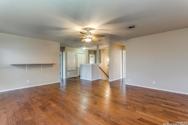 8227 Maloy Mnr, San Antonio, TX 78250 - unfurnished living room featuring ceiling fan, wood finished floors, and baseboards