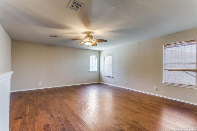 8227 Maloy Mnr, San Antonio, TX 78250 - empty room featuring ceiling fan, dark wood-type flooring, and baseboards