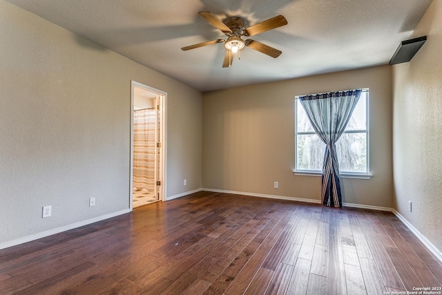8227 Maloy Mnr, San Antonio, TX 78250 - unfurnished room featuring ceiling fan, dark wood-style flooring, and baseboards