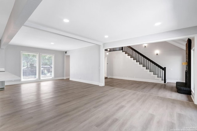 5411 Lancashire, San Antonio, TX 78230 - unfurnished living room with stairway, wood finished floors, baseboards, and recessed lighting