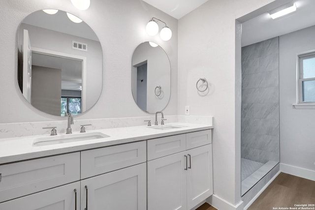 5411 Lancashire, San Antonio, TX 78230 - full bath featuring double vanity, walk in shower, wood finished floors, and baseboards