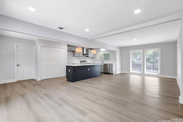 5411 Lancashire, San Antonio, TX 78230 - unfurnished living room with baseboards, light wood finished floors, and recessed lighting