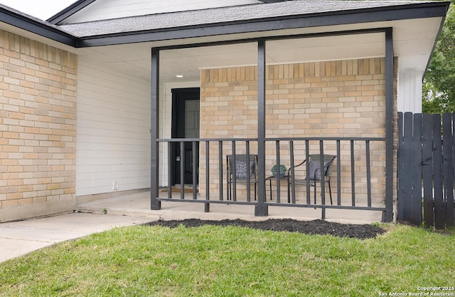 11375 Olney Spgs, San Antonio, TX 78245 - property entrance featuring brick siding and a shingled roof
