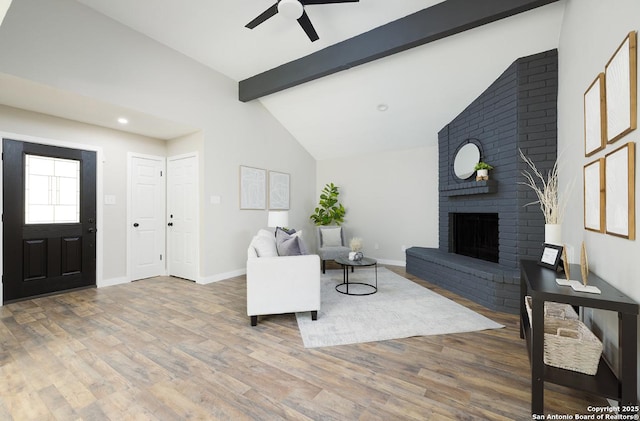 11375 Olney Spgs, San Antonio, TX 78245 - living area with ceiling fan, wood finished floors, a brick fireplace, baseboards, and recessed lighting
