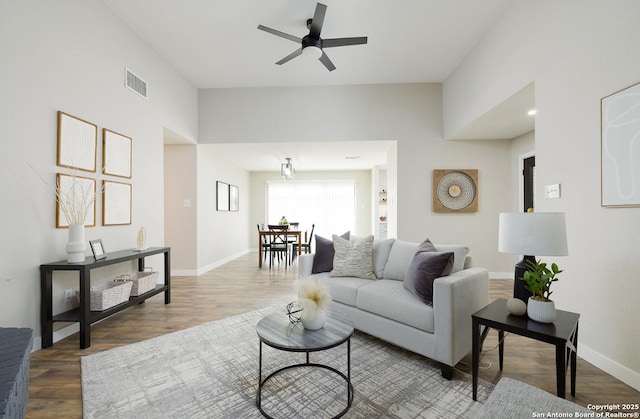 11375 Olney Spgs, San Antonio, TX 78245 - living room with wood finished floors, a ceiling fan, and baseboards