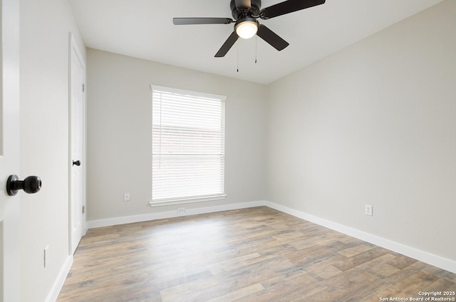 11375 Olney Spgs, San Antonio, TX 78245 - spare room with light wood-type flooring, baseboards, and a ceiling fan