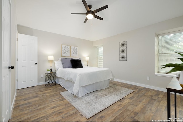 11375 Olney Spgs, San Antonio, TX 78245 - bedroom featuring wood finished floors, baseboards, and a ceiling fan