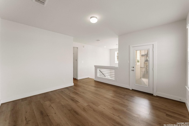 9607 Stillwater Pass, San Antonio, TX 78254 - spare room featuring wood finished floors and baseboards