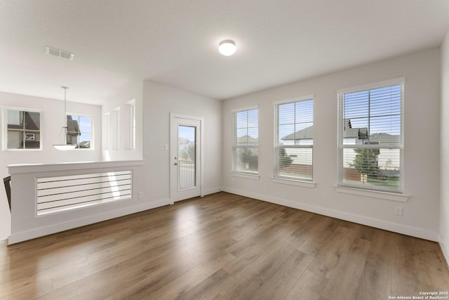 9607 Stillwater Pass, San Antonio, TX 78254 - unfurnished living room with wood finished floors and baseboards