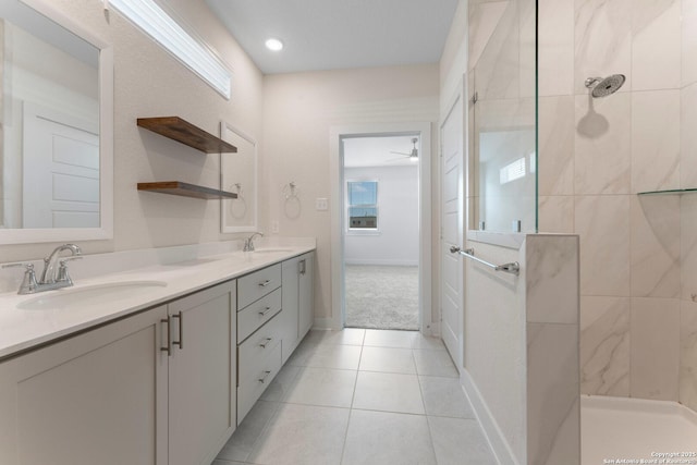9607 Stillwater Pass, San Antonio, TX 78254 - full bath with a tile shower, double vanity, tile patterned flooring, and ceiling fan