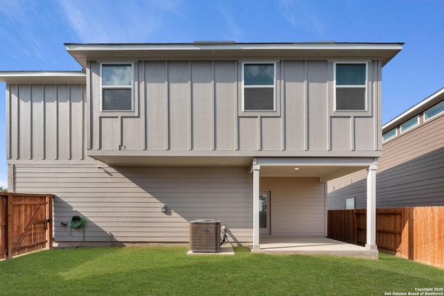 9607 Stillwater Pass, San Antonio, TX 78254 - rear view of property with board and batten siding, a patio area, and central AC