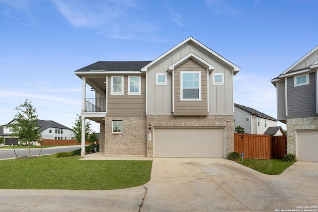 9607 Stillwater Pass, San Antonio, TX 78254 - view of front facade featuring concrete driveway, an attached garage, board and batten siding, brick siding, and a balcony