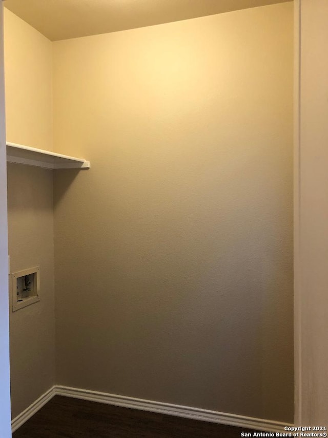 5514 Justin, San Antonio, TX 78240 - washroom with washer hookup, baseboards, and dark wood-style flooring