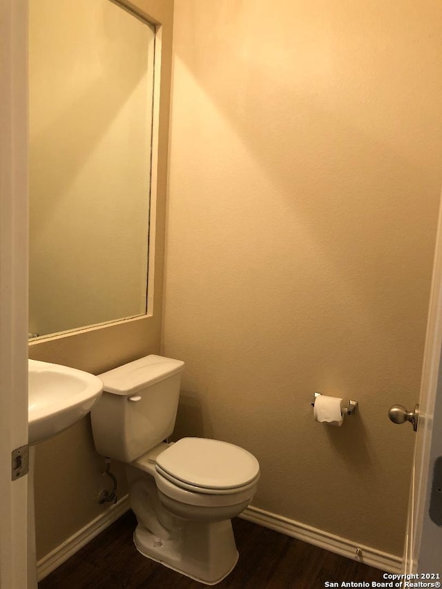 5514 Justin, San Antonio, TX 78240 - bathroom with toilet, baseboards, and wood finished floors