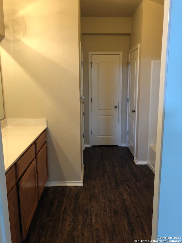 5514 Justin, San Antonio, TX 78240 - full bath featuring wood finished floors, baseboards, vanity, and a tub