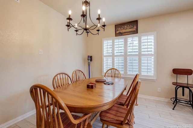 246 Felisa St, San Antonio, TX 78210 - dining space featuring baseboards, a chandelier, and light wood-style floors