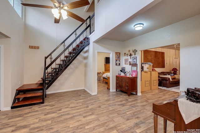 246 Felisa St, San Antonio, TX 78210 - entrance foyer with a towering ceiling, wood finished floors, ceiling fan, stairway, and baseboards