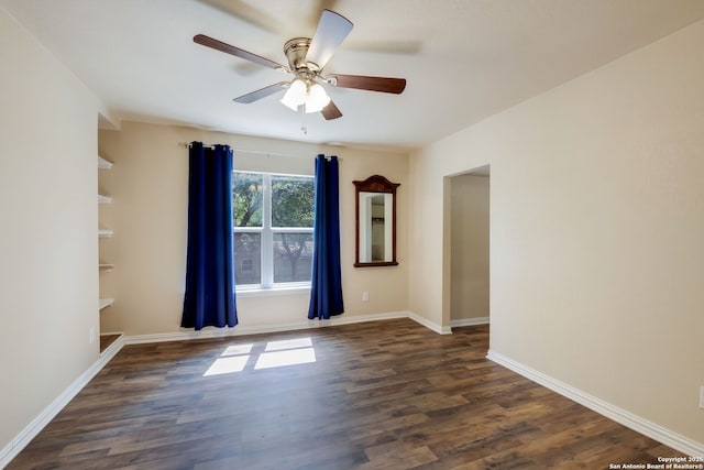 246 Felisa St, San Antonio, TX 78210 - unfurnished room featuring dark wood-style flooring, a ceiling fan, and baseboards