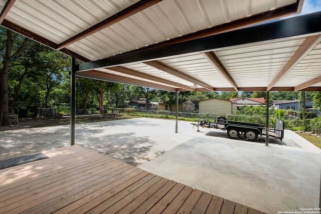 246 Felisa St, San Antonio, TX 78210 - wooden terrace with a patio, a fenced backyard, and a carport