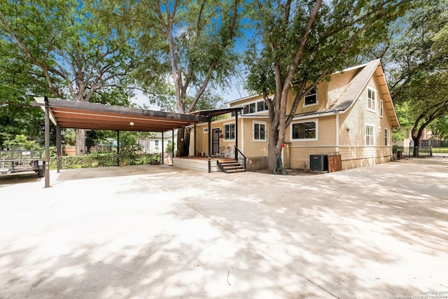 246 Felisa St, San Antonio, TX 78210 - view of front facade with a carport, central AC, and concrete driveway