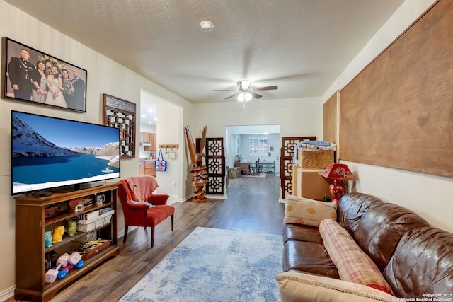 246 Felisa St, San Antonio, TX 78210 - living area with a ceiling fan and wood finished floors