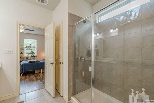 124 Mary Max Cir, San Marcos, TX 78666 - full bathroom featuring ensuite bath, a shower stall, ceiling fan, and tile patterned flooring