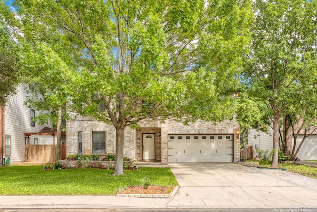 18718 Legend Oaks, San Antonio, TX 78259 - obstructed view of property with concrete driveway, brick siding, and an attached garage