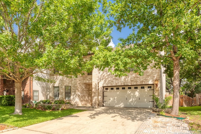 18718 Legend Oaks, San Antonio, TX 78259 - obstructed view of property featuring driveway, brick siding, and an attached garage