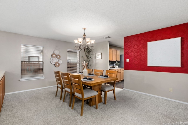 18718 Legend Oaks, San Antonio, TX 78259 - dining room featuring a chandelier, light colored carpet, baseboards, and a textured ceiling