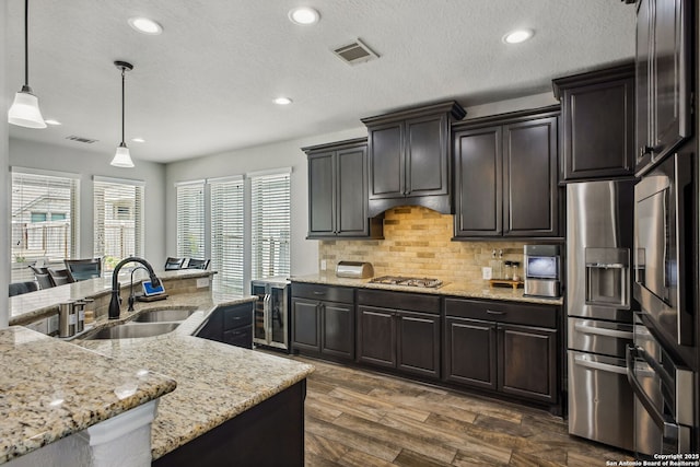 14042 Gemma, San Antonio, TX 78253 - kitchen with wine cooler, a sink, stainless steel appliances, healthy amount of natural light, and recessed lighting