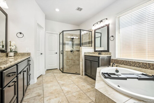 14042 Gemma, San Antonio, TX 78253 - bathroom featuring a stall shower, a bath, two vanities, and tile patterned floors