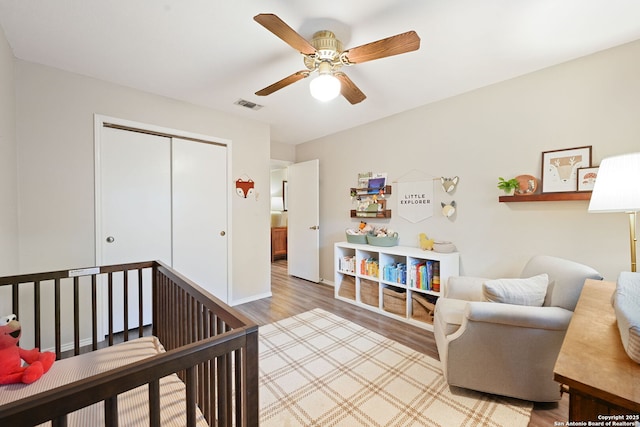 5535 Timber Cyn, San Antonio, TX 78250 - bedroom featuring light wood-type flooring, a closet, baseboards, and ceiling fan