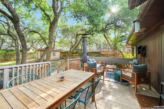 5535 Timber Cyn, San Antonio, TX 78250 - wooden deck with a fenced backyard, outdoor dining area, and outdoor lounge area