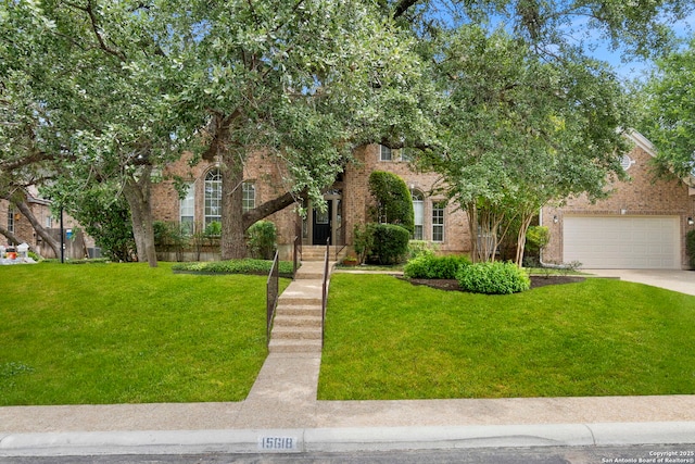 15618 Dawn Crst, San Antonio, TX 78248 - view of property hidden behind natural elements featuring brick siding, concrete driveway, and a front lawn