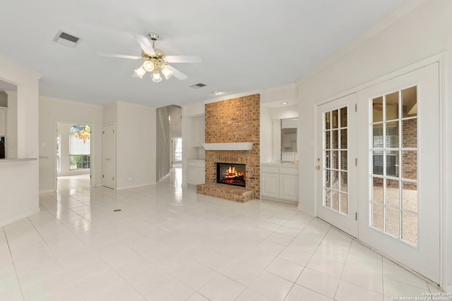 15618 Dawn Crst, San Antonio, TX 78248 - unfurnished living room featuring ornamental molding, a ceiling fan, light tile patterned flooring, a fireplace, and baseboards