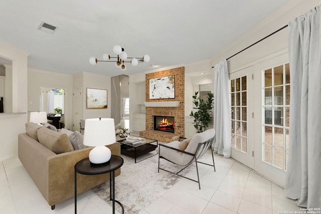 15618 Dawn Crst, San Antonio, TX 78248 - living room with crown molding, a fireplace, light tile patterned floors, and a chandelier