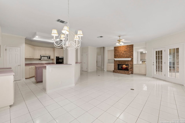 15618 Dawn Crst, San Antonio, TX 78248 - kitchen featuring stainless steel microwave, black oven, ornamental molding, open floor plan, and ceiling fan