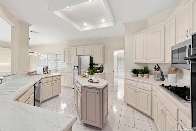 15618 Dawn Crst, San Antonio, TX 78248 - kitchen featuring light tile patterned floors, a sink, appliances with stainless steel finishes, light stone counters, and a raised ceiling