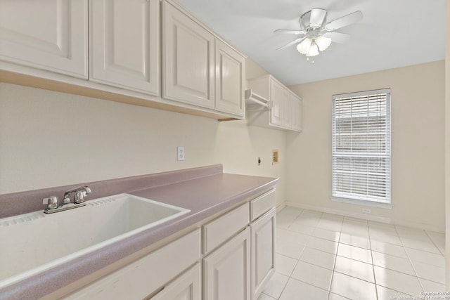 15618 Dawn Crst, San Antonio, TX 78248 - washroom featuring cabinet space, washer hookup, ceiling fan, light tile patterned floors, and baseboards