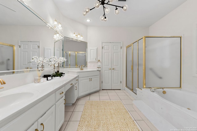 15618 Dawn Crst, San Antonio, TX 78248 - bathroom featuring a chandelier, double vanity, a shower stall, a bath, and tile patterned floors