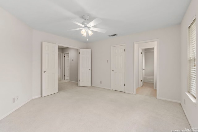15618 Dawn Crst, San Antonio, TX 78248 - unfurnished bedroom with light carpet, baseboards, connected bathroom, and a ceiling fan