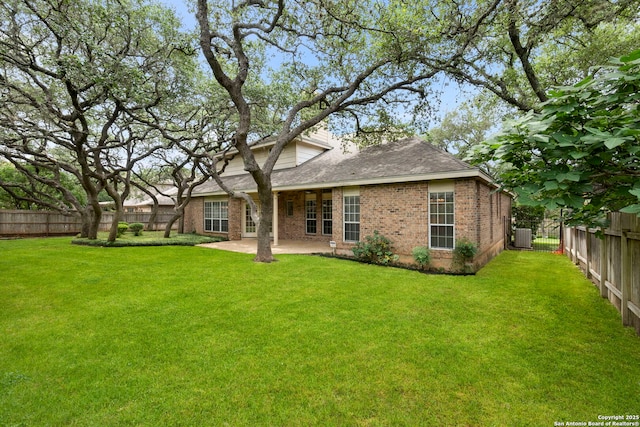15618 Dawn Crst, San Antonio, TX 78248 - rear view of house featuring brick siding, a patio area, a shingled roof, and central AC unit