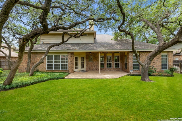 15618 Dawn Crst, San Antonio, TX 78248 - rear view of property featuring a patio area, a chimney, brick siding, and roof with shingles