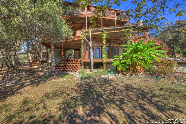 642 Lakebreeze, Canyon Lake, TX 78133 - back of property with a deck and stairs
