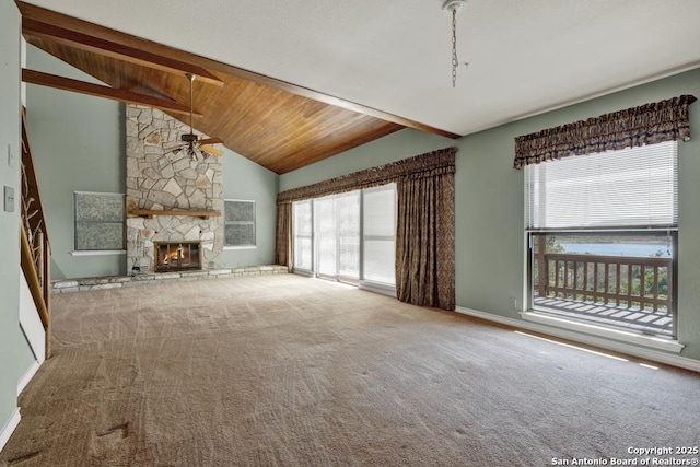 642 Lakebreeze, Canyon Lake, TX 78133 - unfurnished living room featuring ceiling fan, carpet, and a fireplace